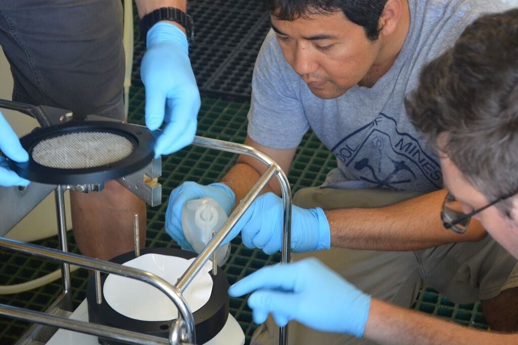 Post-doctoral students Jimmy Saw (OSU) and Zach Landry (OSU) setting up the McLane in-situ pumps.